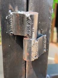 Farm gate hinge welding repair close-up for a Quinte area rural property